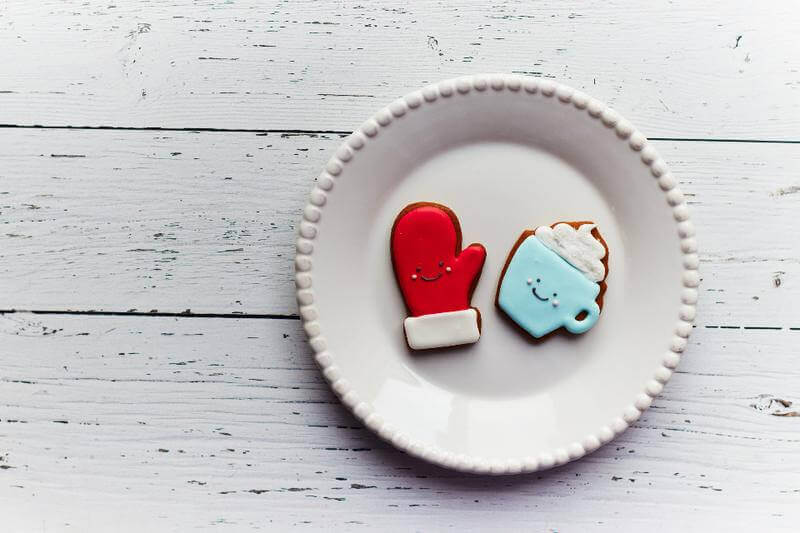 Christmas cookies shaped like a mitten and a mug